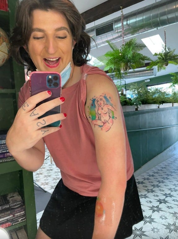 May be an image of one or more people and tattoo