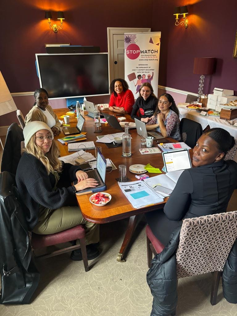A photo of the Girls Research Project team working on the findings
