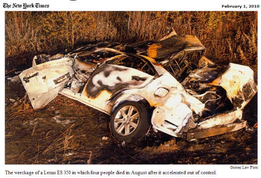 A pancaked Lexus E350, following a horrendous high-speed accident. The car shows evidence of burn marks.