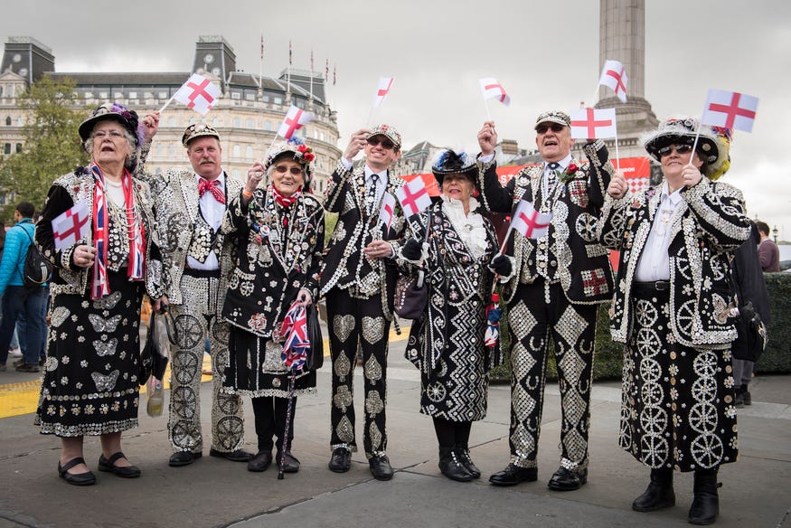 The Pearly Kings and Queens posing for a photo in Trafalgar Square The Pearly Kings and Queens posing for a photo in Trafalgar Square