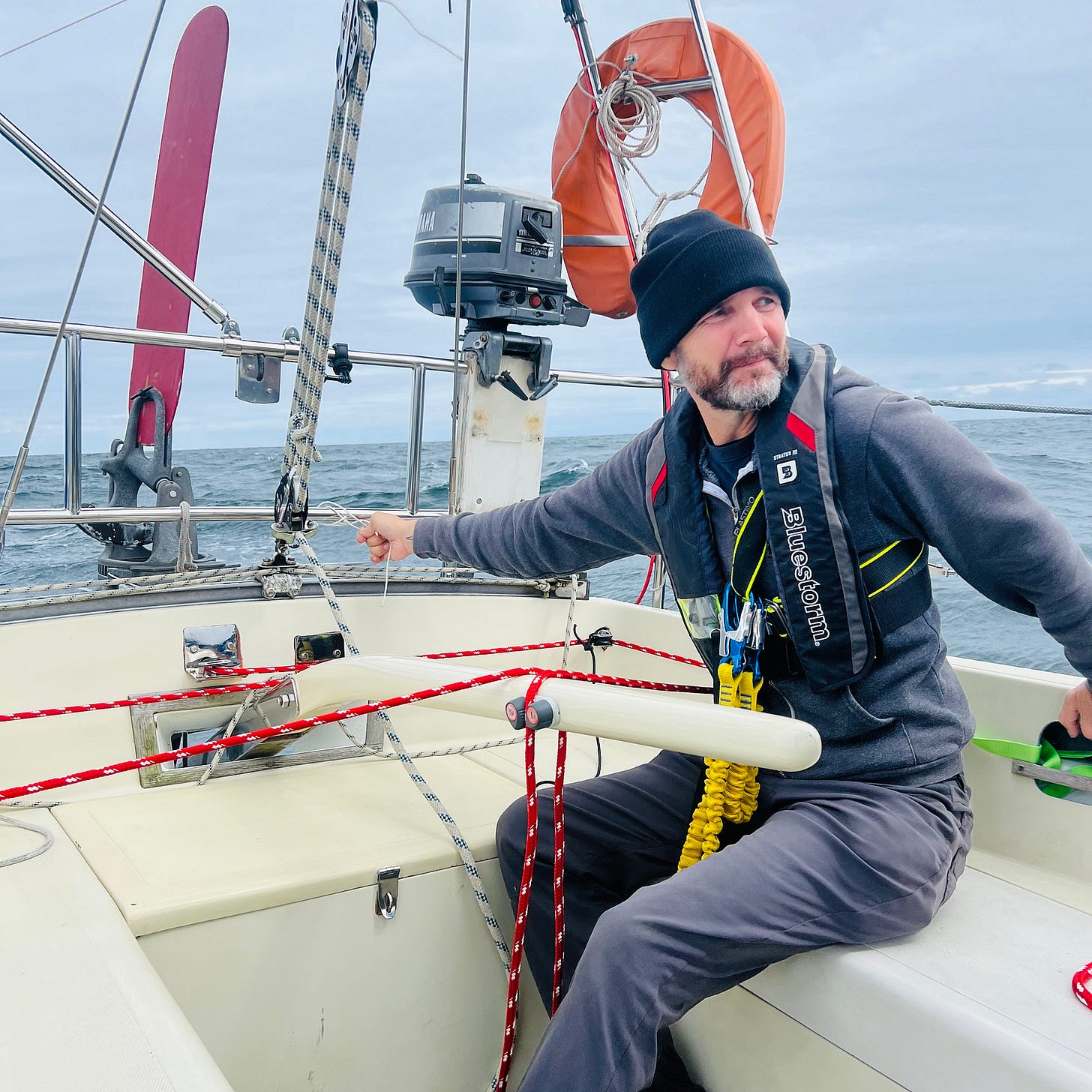 Captain adjusting the steering on sailboat journey to Deltaville
