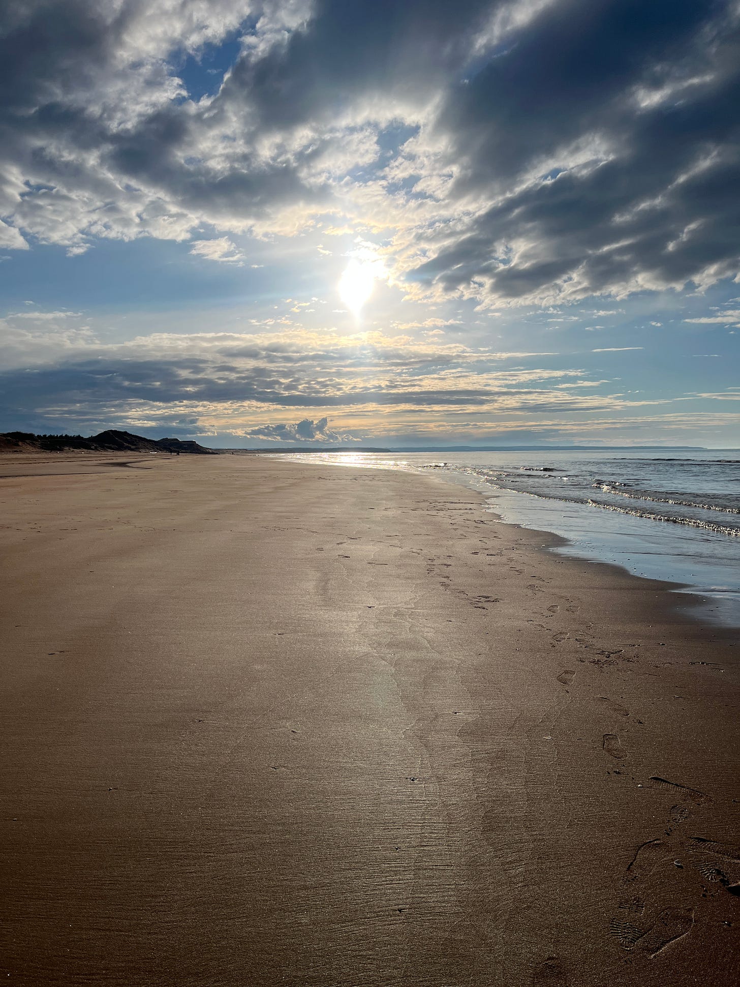 a sunset over a PEI red-sandy beach a sunset over a PEI red-sandy beach
