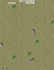 A pair of screenshots from the arcade version of Gyrodine. They show the attack helicopter firing from a variety of angles, with the shots following the direction that the nose of the chopper is pointed in. The first screenshot takes place over the water, the second in a desert with tanks on the ground.