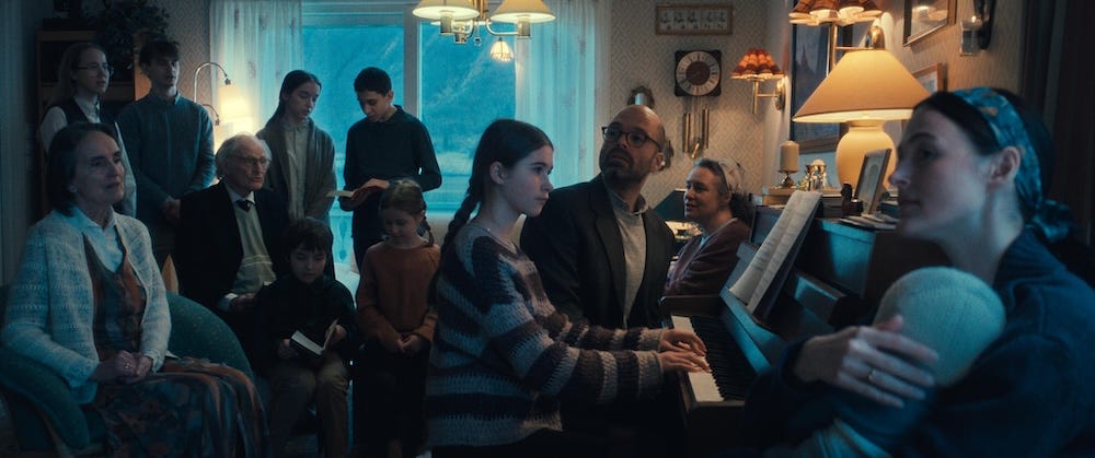 Sebastian Stan, Renate Reinsve and other cast members of Fjord sitting in a living room