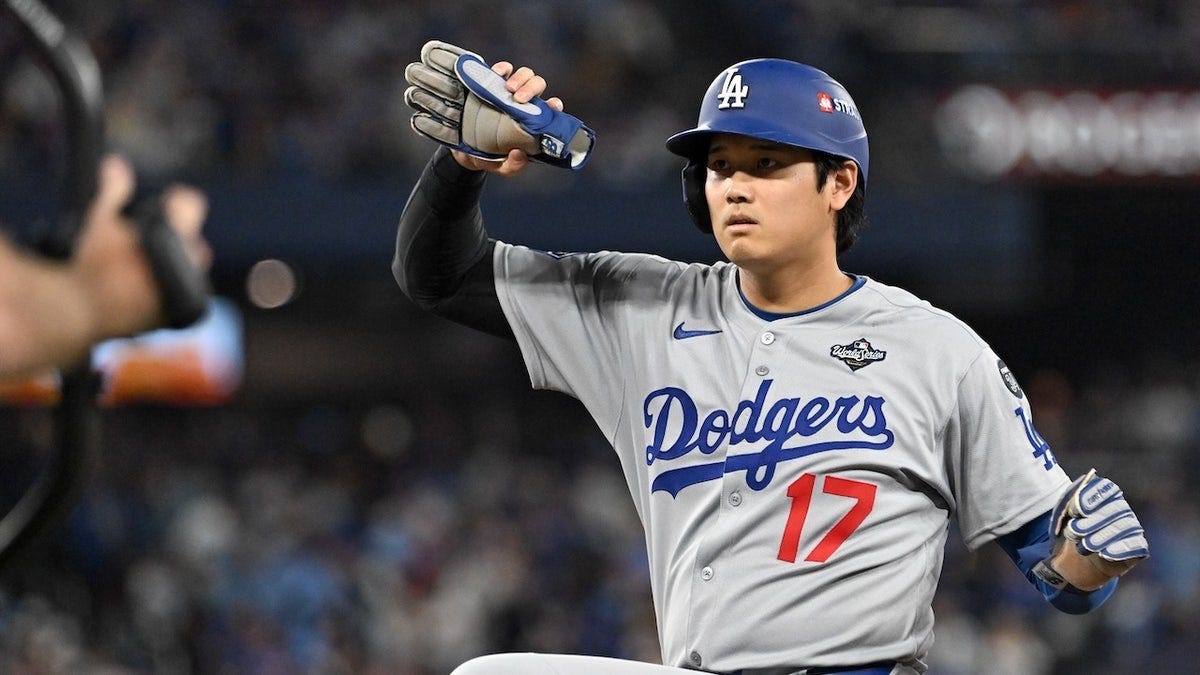 Los Angeles Dodgers designated hitter Shohei Ohtani celebrates after hitting a single against the Toronto Blue Jays in the eighth inning during Game 2 of the 2025 MLB World Series at Rogers Centre.
