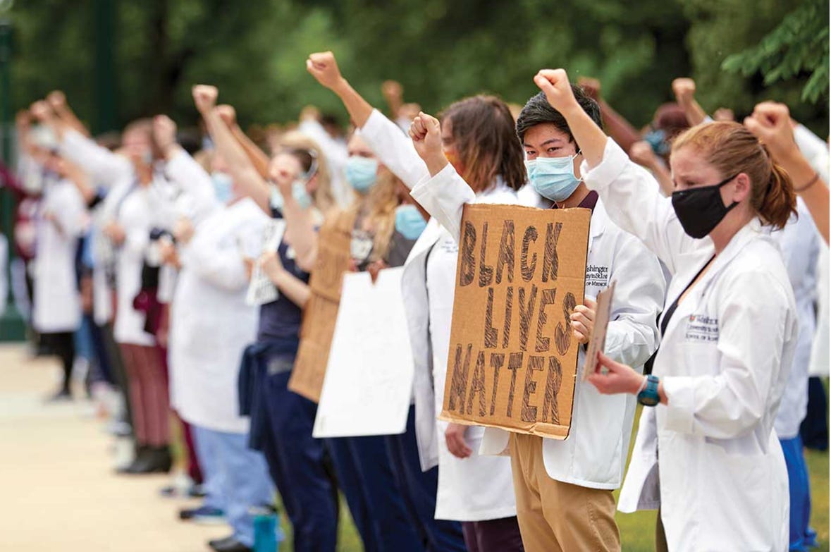 A group of people protesting

AI-generated content may be incorrect.