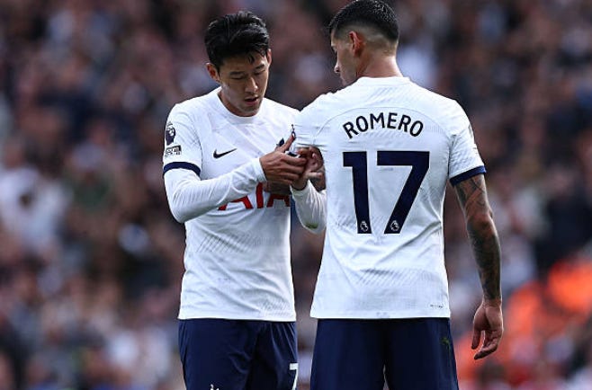 Tottenham Hotspur's South Korean striker #07 Son Heung-Min (L) gives the captain's armband to Tottenham Hotspur's Argentinian defender #17 Cristian Romero (R) as he leaves the game during the English Premier League football match between Arsenal and Tottenham Hotspur at the Emirates Stadium in London on September 24, 2023. (Photo by HENRY NICHOLLS / AFP via Getty Images) / RESTRICTED TO EDITORIAL USE. No use with unauthorized audio, video, data, fixture lists, club/league logos or 'live' services. Online in-match use limited to 120 images. An additional 40 images may be used in extra time. No video emulation. Social media in-match use limited to 120 images. Tottenham Hotspur's South Korean striker #07 Son Heung-Min (L) gives the captain's armband to Tottenham Hotspur's Argentinian defender #17 Cristian Romero (R) as he leaves the game during the English Premier League football match between Arsenal and Tottenham Hotspur at the Emirates Stadium in London on September 24, 2023. (Photo by HENRY NICHOLLS / AFP via Getty Images) / RESTRICTED TO EDITORIAL USE. No use with unauthorized audio, video, data, fixture lists, club/league logos or 'live' services. Online in-match use limited to 120 images. An additional 40 images may be used in extra time. No video emulation. Social media in-match use limited to 120 images.