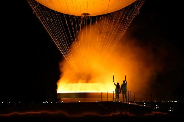 Paris Opening Ceremony: Marie-José Pérec and Teddy Riner light the Olympic  cauldron - Yahoo Sports