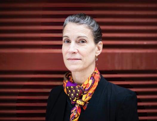 A person in a black suit

AI-generated content may be incorrect.