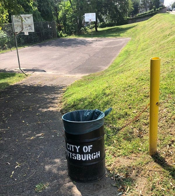 City of Pittsburgh trash can at Cobden Park.
