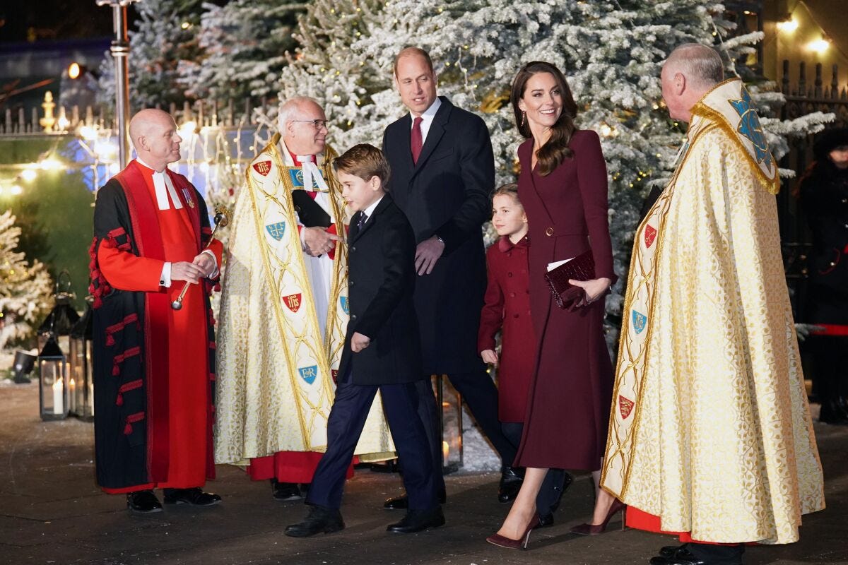 Britain's Prince William and Kate, Princess of Wales, arrive with their children Princess Charlotte and Prince George for the 'Together at Christmas' Carol Service at Westminster Abbey in London, Thursday, Dec. 15, 2022. (James Manning/PA via AP)