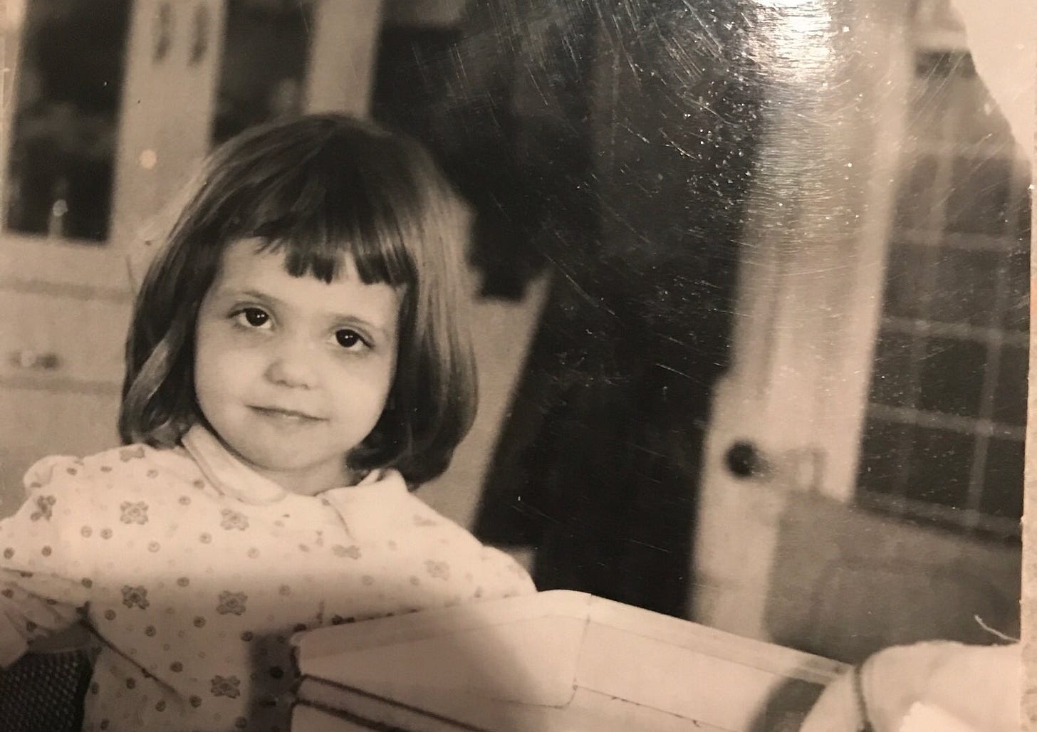 A picture of a child. This is the author, Kyra’s, other mother, Kathy, when she was a toddler.