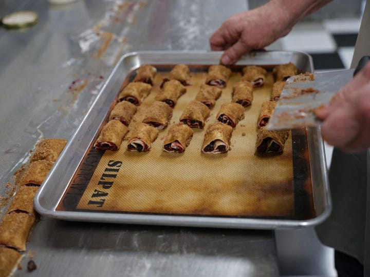 Cutting the cookies, placing them on a sheet pan