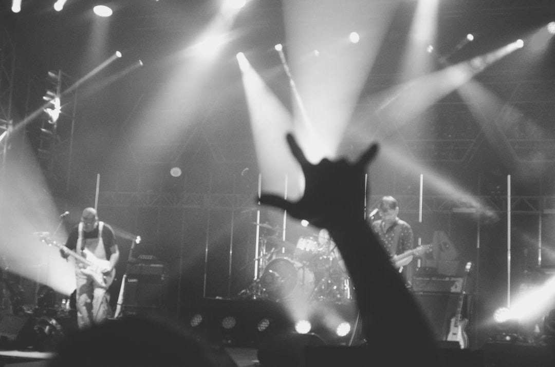 a band playing on stage a band playing on stage