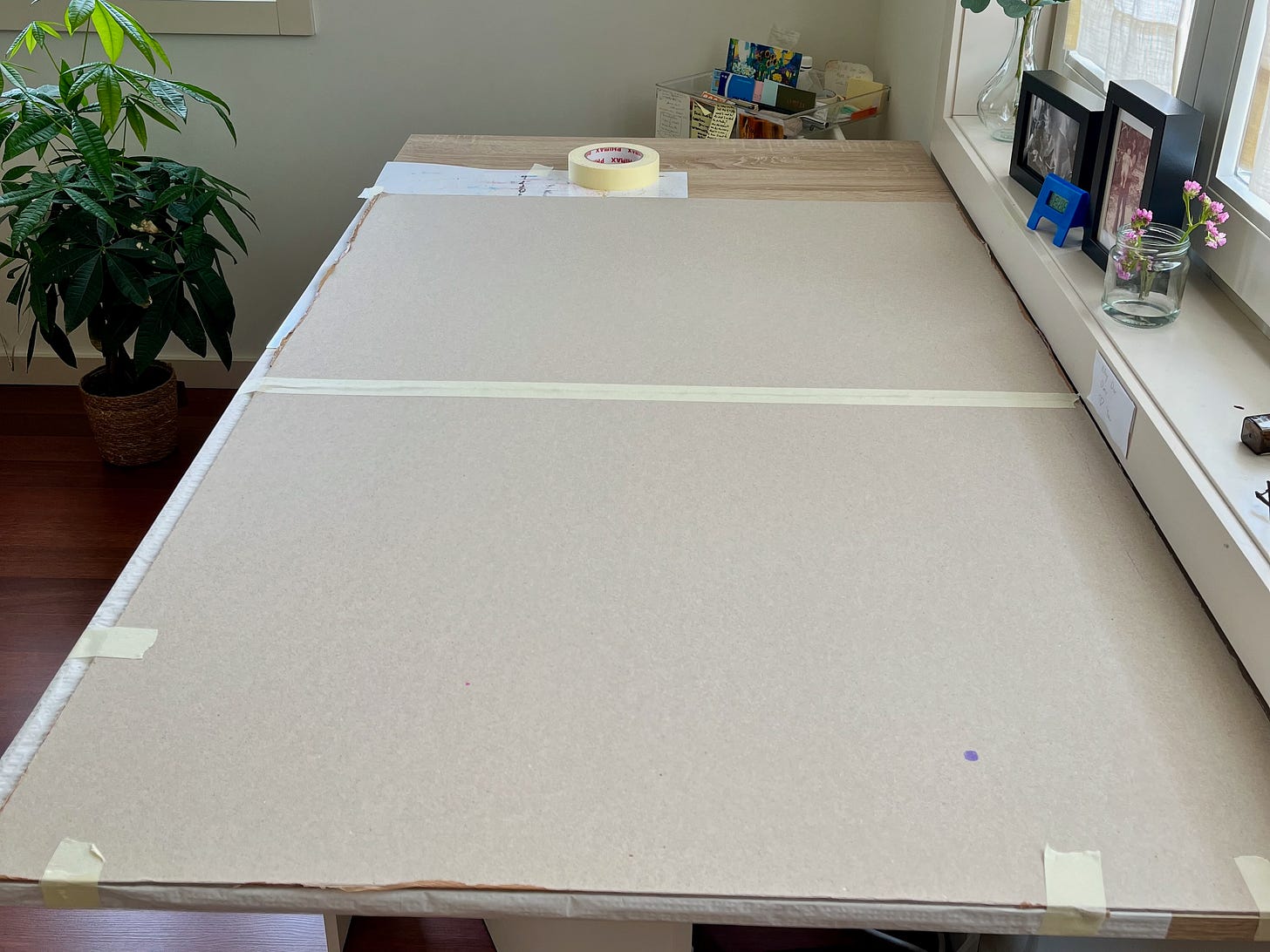 image: a table converted into a studio painting table