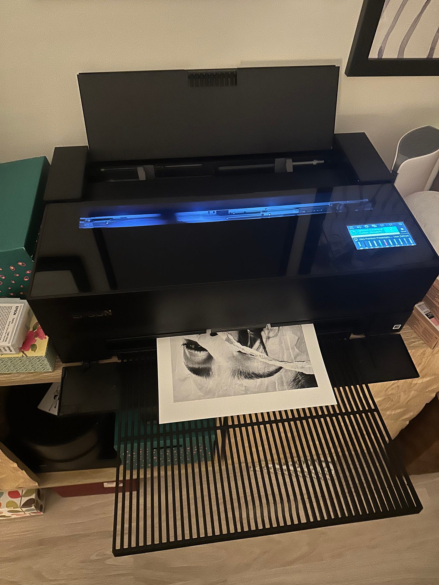 An Epson photo printer producing a large print for the Miami Art Week show, part of the technical process behind preparing the exhibition. An Epson photo printer producing a large print for the Miami Art Week show, part of the technical process behind preparing the exhibition.