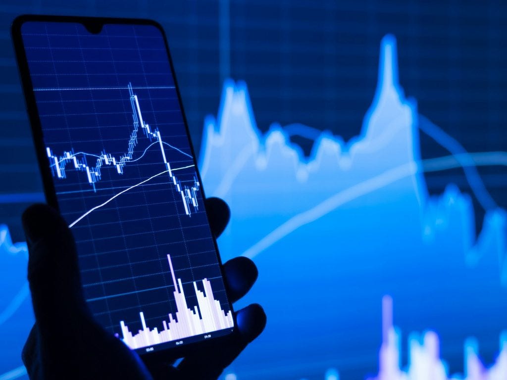 Stock chart on a mobile as the UK and Singapore lay the groundwork for what might become a blueprint for international AI cooperation in finance alongside blockchain and other fintech technologies.