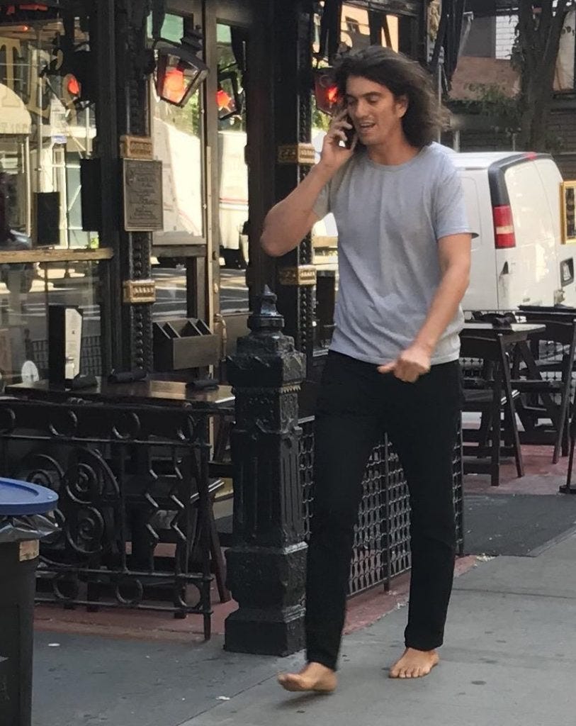 this photo of adam neumann walking barefoot in nyc hours before leaving  wework gives me kony 2012 energy when the director lost his mind and went  streaking