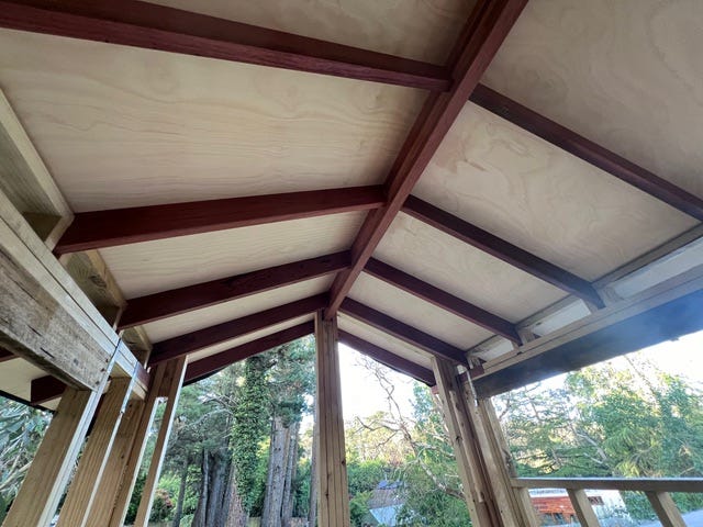 Looking up at the marine plywood roof supported by very strong beams. Looking up at the marine plywood roof supported by very strong beams.
