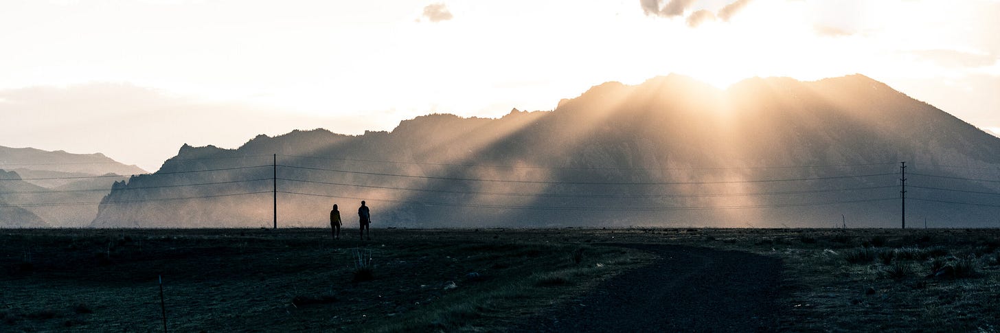 Hikers and dust, shadow and light. Hikers and dust, shadow and light.