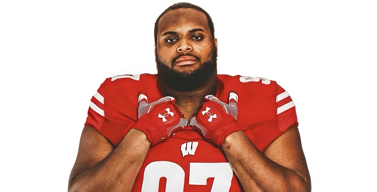 Wisconsin Badgers transfer DL Junior Poyser.  