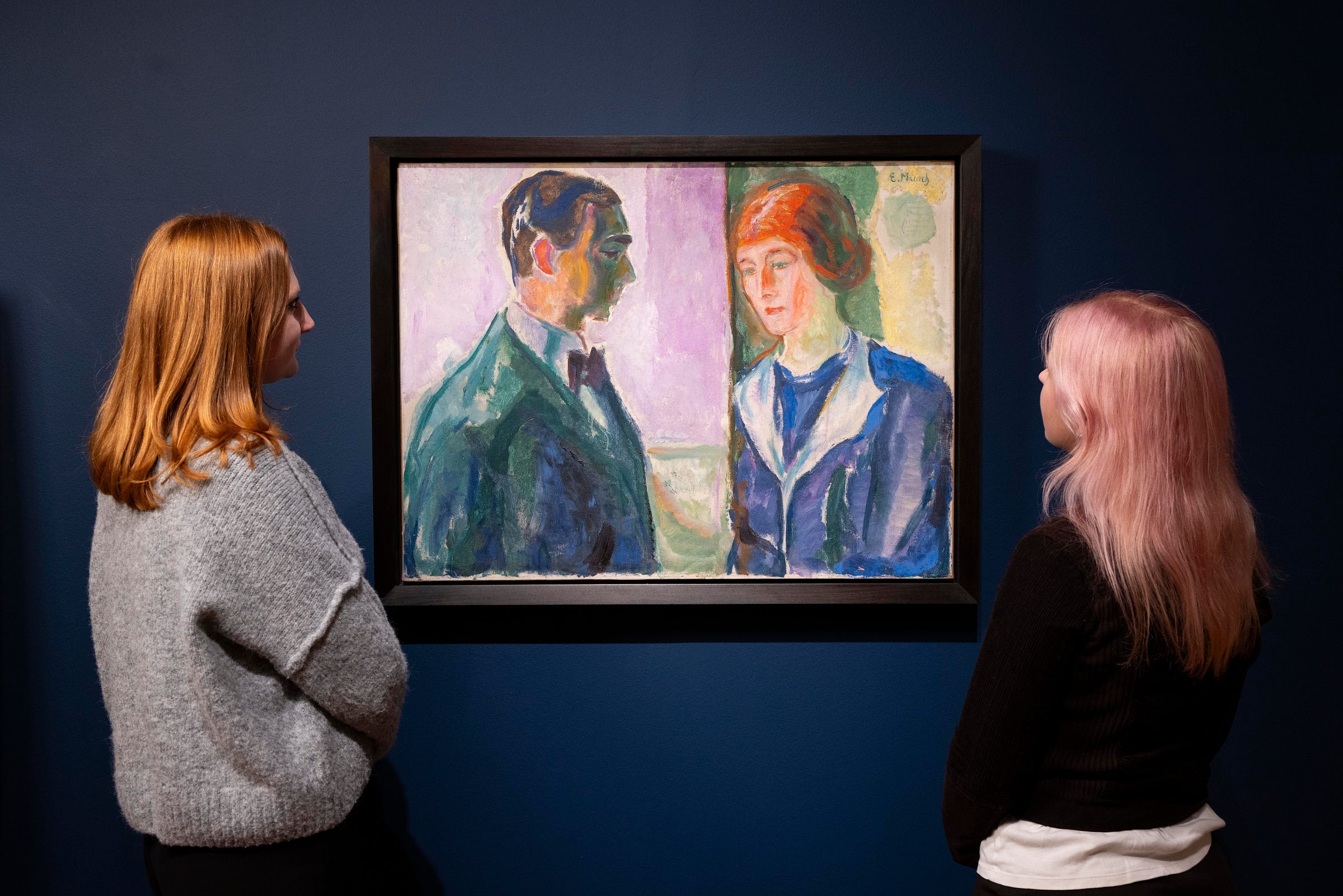 Visitors observe Kate and Hugo Peris (1913) by Edvard Munch, displayed as part of the exhibition Edvard Munch Portraits at the National Portrait Gallery