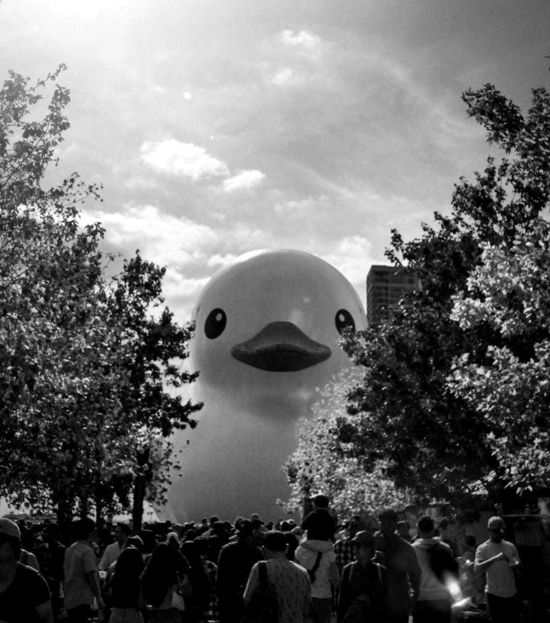 a large rubber ducky floating in the air a large rubber ducky floating in the air