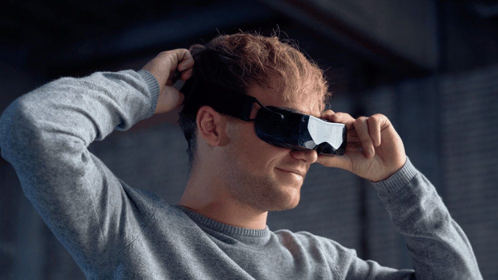 A man wearing a Bigscreen Beyond headset A man wearing a Bigscreen Beyond headset