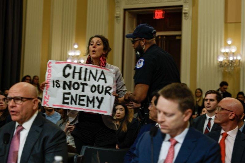 A person holding a sign

AI-generated content may be incorrect.