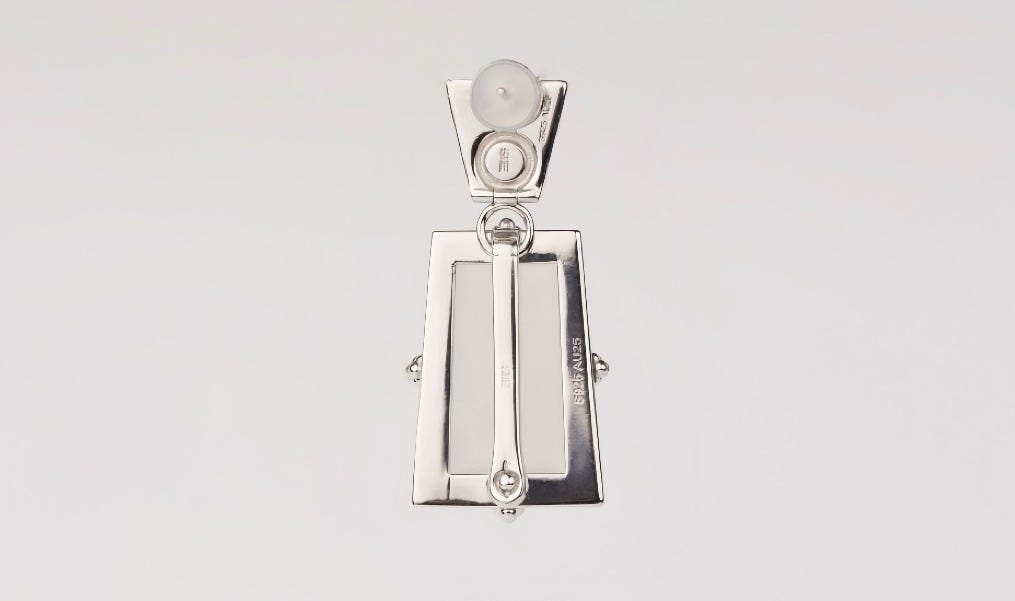 The backside of a pendant from The Auyu Collection by Aesth & Util | Trove & Tone