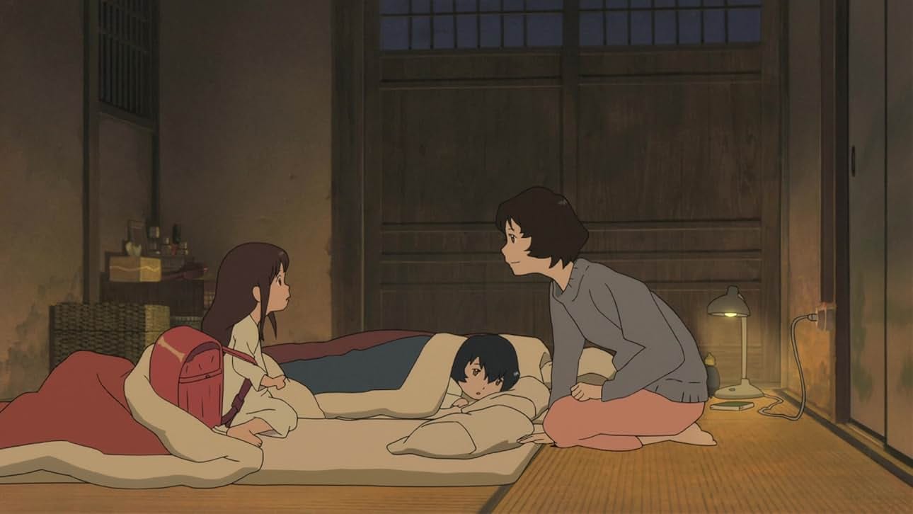 Hana talks to Yuki with Ame in the background in their bedroom.