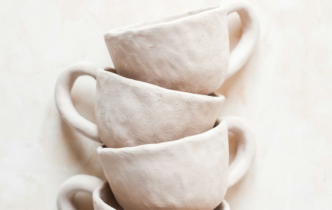 white ceramic mug on white table white ceramic mug on white table