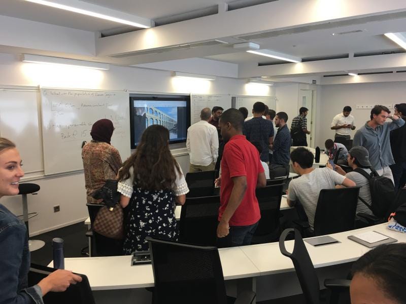a group of people standing in a room