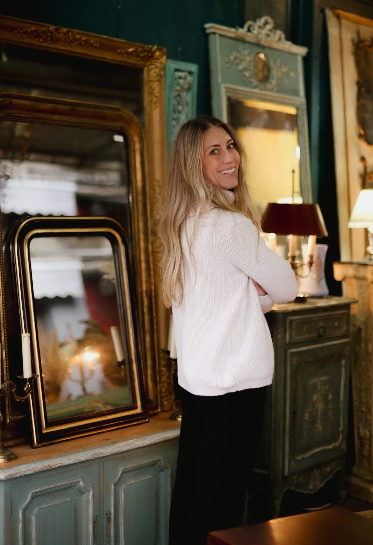 Standing in front of a collection of vintage mirrors at a flea market, surrounded by ornate and unique designs reflecting the rich history of each piece. Standing in front of a collection of vintage mirrors at a flea market, surrounded by ornate and unique designs reflecting the rich history of each piece.