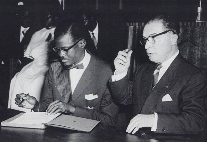 File:Patrice Lumumba signs the document granting independence to the Congo next to Belgian Prime Minister Gaston Eyskens.jpg File:Patrice Lumumba signs the document granting independence to the Congo next to Belgian Prime Minister Gaston Eyskens.jpg