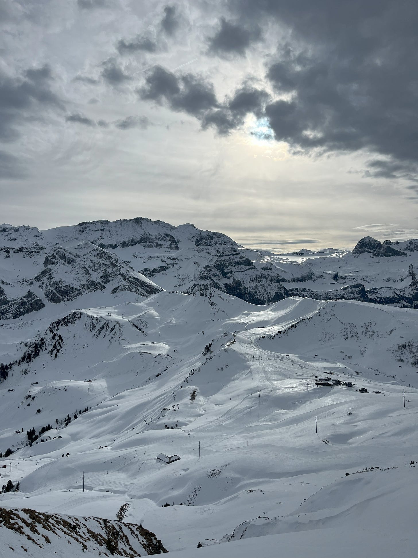 light hitting the alps in Adelboden, Switzerland with a dark sky