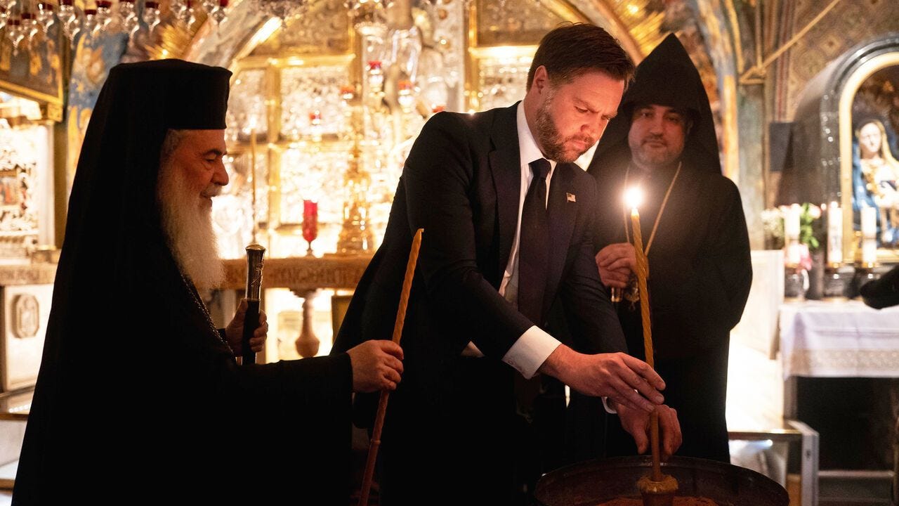 U.S. Vice President JD Vance lights a candle.