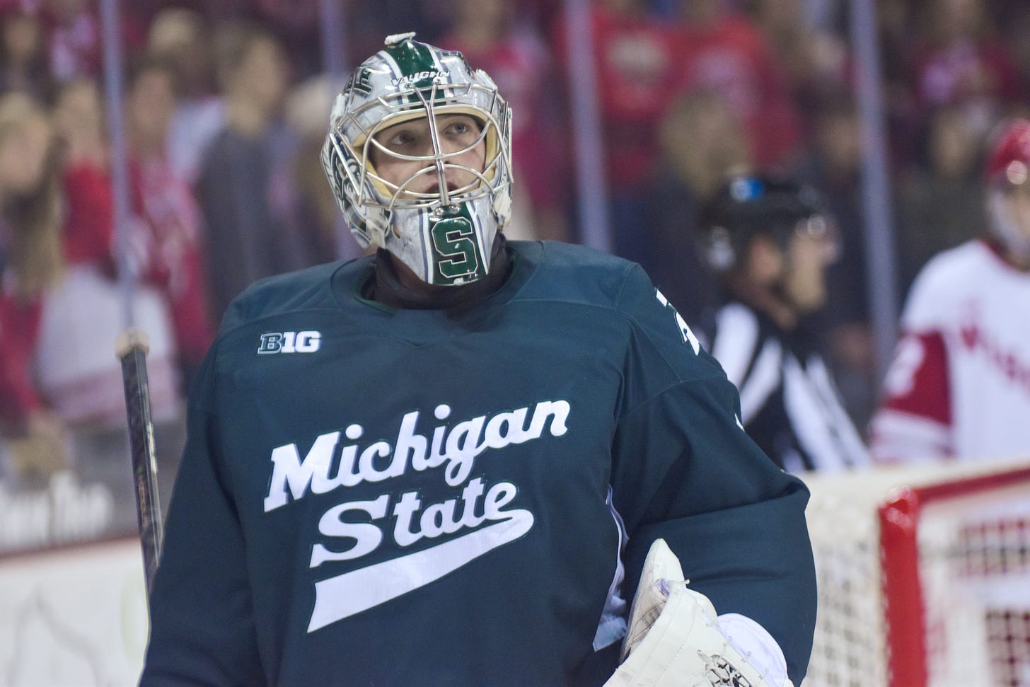 Michigan State hockey goaltender Trey augustine looks up into the crowd during a break in play at the Kohl Center during a win over the Wisconsin Badgers Michigan State hockey goaltender Trey augustine looks up into the crowd during a break in play at the Kohl Center during a win over the Wisconsin Badgers