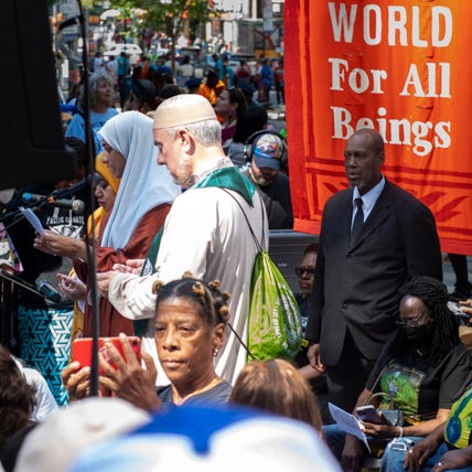 Six photos showing closeups of marchers with various banners and signs