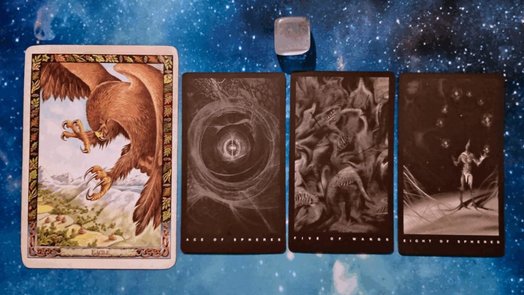 New Moon Magic: Your July 2025 Pick-a-Card Tarot Reading, pile 1 - clear quartz stone and 4 cards on a starry blue background