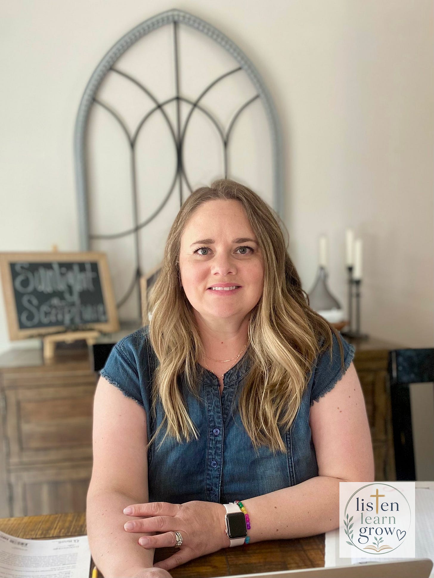 Homeschool mom reviewing lessons for APD child at kitchen table with open Bible nearby Homeschool mom reviewing lessons for APD child at kitchen table with open Bible nearby