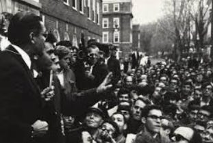 A group of people standing in a crowd

AI-generated content may be incorrect.