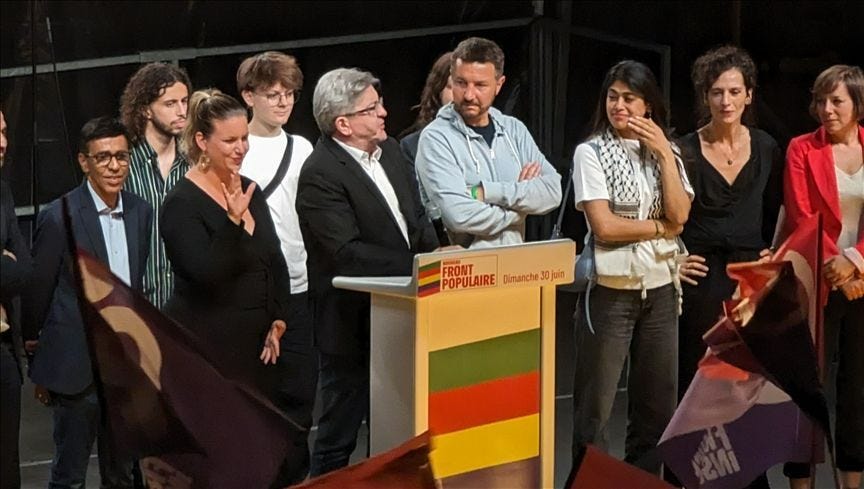 The New Popular Front - a diverse alliance who in this photo just have far too many leaders to fit at that one podium!