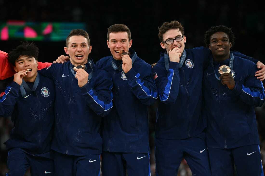 Members of the U.S. men's gymnastics team pose with their bronze medal following the men's team final on Monday. It's the first Olympic medal for the U.S. in the event since 2008.