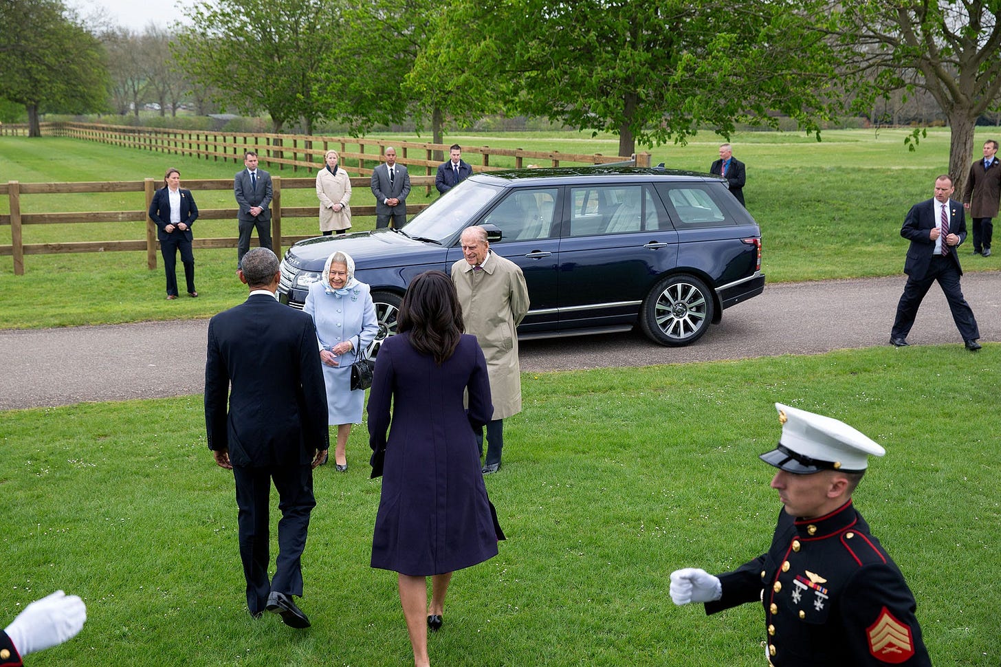 April 22, 2016: A unique perspective captures Queen Elizabeth approaching as President Obama and First Lady Michelle Obama arrive by helicopter, welcomed at historic Windsor Castle. April 22, 2016: A unique perspective captures Queen Elizabeth approaching as President Obama and First Lady Michelle Obama arrive by helicopter, welcomed at historic Windsor Castle.