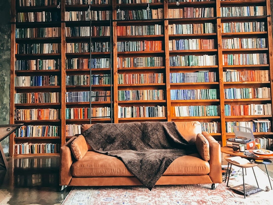 brown wooden book shelves with books brown wooden book shelves with books