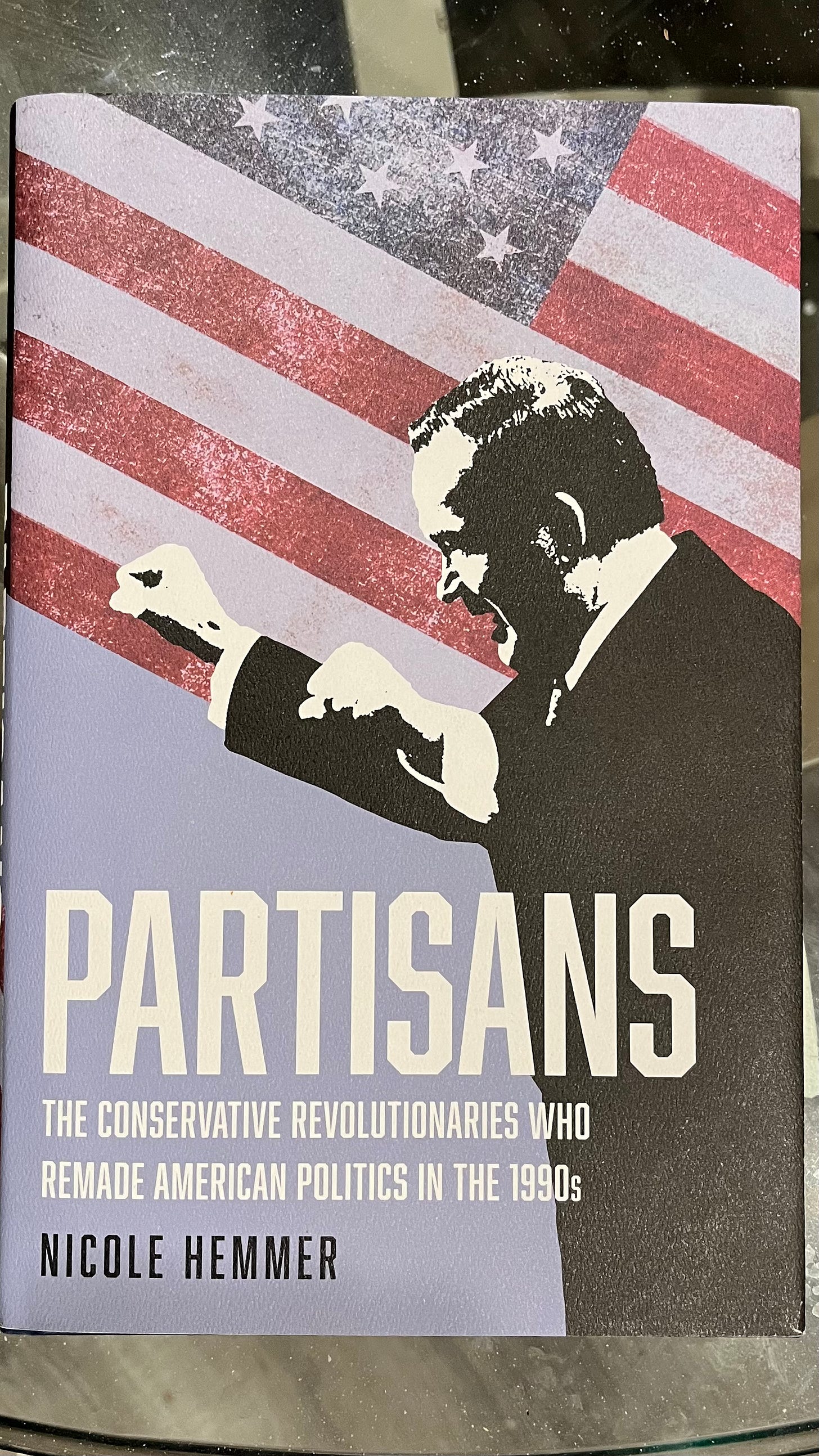 An image of a book written by Nicole Hemmer titled Partisans