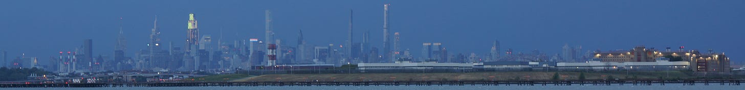 Image of the New York City skyline with Rikers Island in the foreground