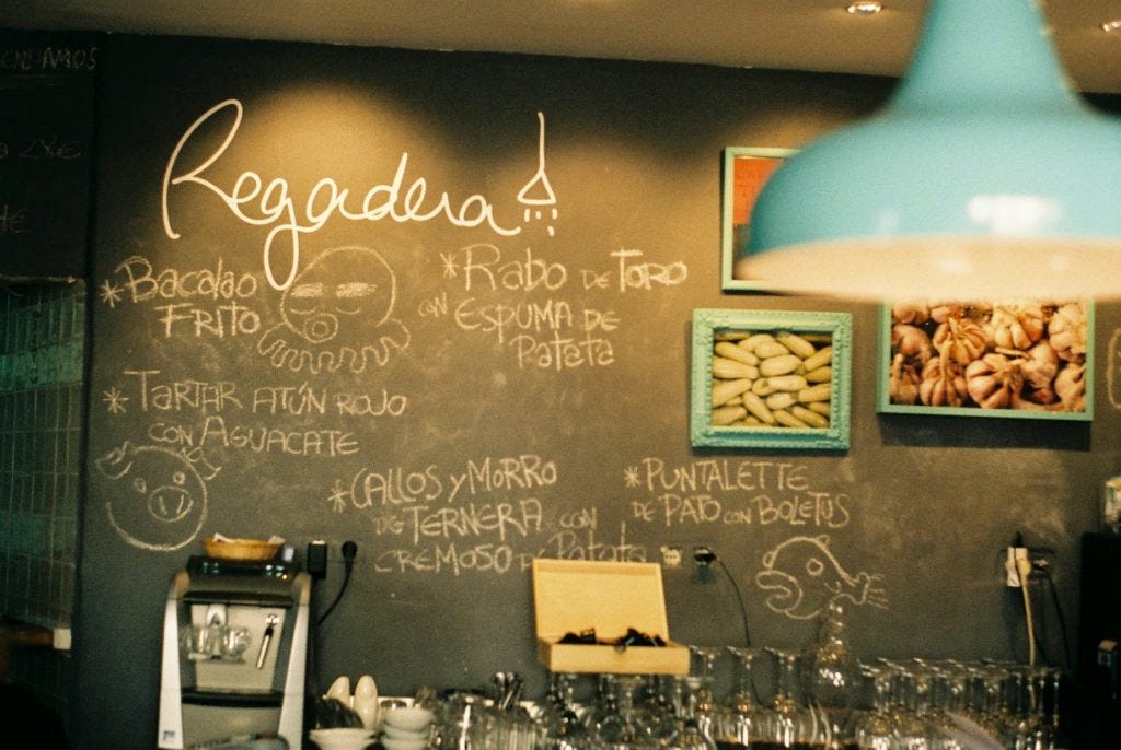 Menu on chalkboard at Regadera restaurant in Córdoba.