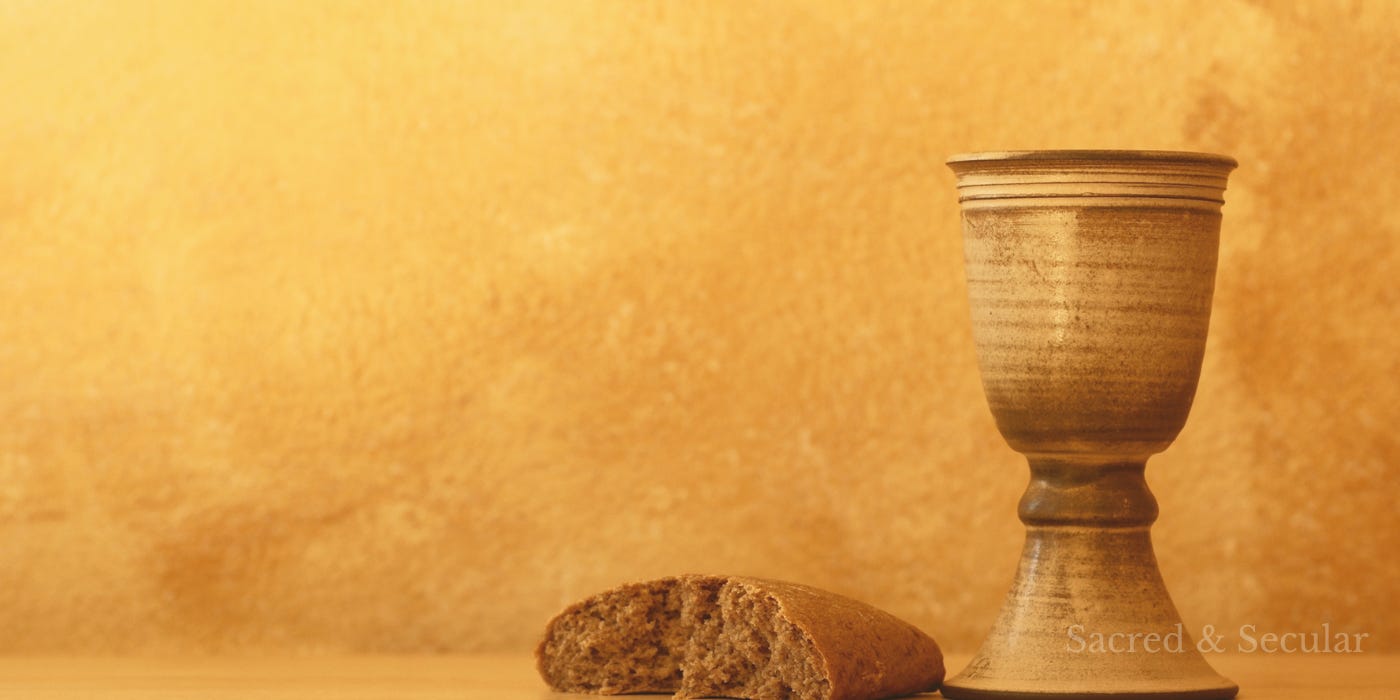 A simple table with bread and a cup in warm, low light, evoking the setting of the Last Supper and a moment of quiet tension.